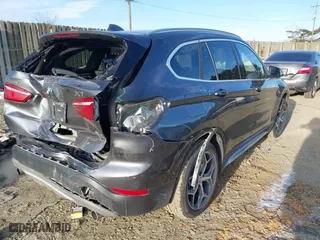 2018 BMW X1 xDrive28i with VIN WBXHT3C33J5F90349, listed as a IAAI auction lot 41385063 with 55,994 mi miles. Bid and sale history available at carsss.com. Image 4.