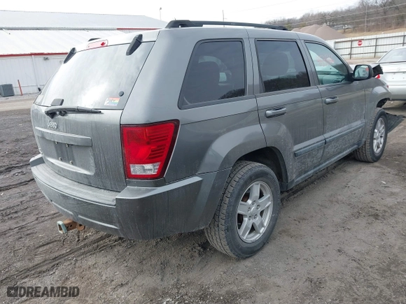 2007 Jeep Grand Cherokee Laredo with VIN 1J8GR48K57C556517, listed as a IAAI auction lot 41534166 with 158,914 mi miles. Bid and sale history available at carsss.com. Image 4.
