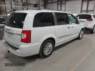 2014 Chrysler Town & Country Limited with VIN 2C4RC1GG7ER178802, listed as a IAAI auction lot 41863918 with 103,777 mi miles and . Bid and sale history available at DreamBid. Image 4.