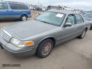 1999 Ford Crown Victoria LX with VIN 2FAFP74W4XX192490, listed as a IAAI auction lot 41791909 with 115,469 mi miles. Bid and sale history available at carsss.com. Image 2.