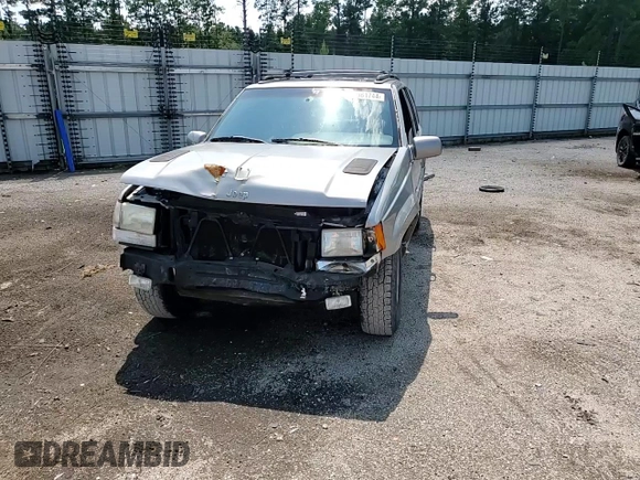 1998 Jeep Grand Cherokee Limited with VIN 1J4GZ88Z9WC148445, listed as a Copart auction lot 65961744 with 180,067 mi miles and Clean Title. Bid and sale history available at carsss.com. Image 14.