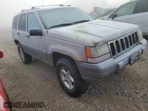 1997 Jeep Grand Cherokee Laredo with VIN 1J4GZ58Y6VC603370, listed as a Copart auction lot 82802794 with 0 mi miles and Salvage Title. Bid and sale history available at carsss.com. Image 4.