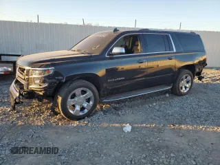 2017 Chevrolet Suburban Premier with VIN 1GNSKJKC5HR303600, listed as a Copart auction lot 83395644 with 124,465 mi miles and Salvage Title. Bid and sale history available at DreamBid. Image 1.