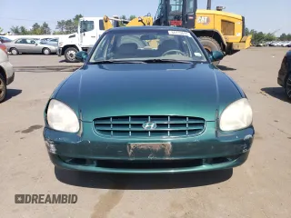 1999 Hyundai Sonata GLS with VIN KMHWF35V9XA100869, listed as a Copart auction lot 68219694 with 144,388 mi miles and Non Repairable. Bid and sale history available at carsss.com. Image 5.