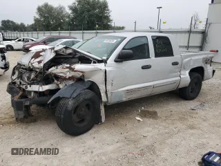 2005 Dodge Dakota Laramie with VIN 1D7HW58N75S100449, listed as a Copart auction lot 86336834 with Not Provided miles and Salvage Title. Bid and sale history available at DreamBid. Image 1.