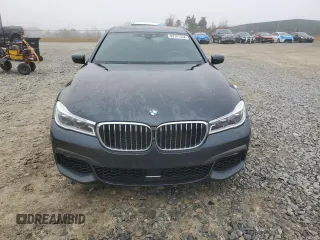 2019 BMW 7 Series 750i with VIN WBA7F0C54KGM25281, listed as a Copart auction lot 84741334 with 76,472 mi miles and Salvage Title. Bid and sale history available at carsss.com. Image 5.