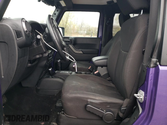 2017 Jeep Wrangler Willys Wheeler with VIN 1C4AJWAG0HL641188, listed as a Copart auction lot 52814005 with 94,959 mi miles and Salvage Title. Bid and sale history available at DreamBid. Image 7.