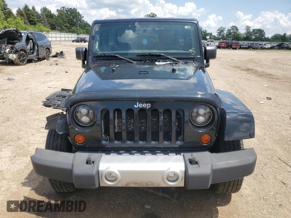 2012 Jeep Wrangler Unlimited Sahara z VIN 1C4HJWEG6CL141988, wystawiony jako Copart lot #61631115 z przebiegiem 140 401 mil mil oraz Szkoda całkowita • Salvage title. Historia ofert i sprzedaży dostępna na DreamBid. Obrazek 5.