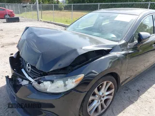 2016 Mazda Mazda6 i Touring with VIN JM1GJ1V53G1431880, listed as a IAAI auction lot 42079970 with 111,179 mi miles. Bid and sale history available at carsss.com. Image 6.