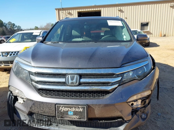 2017 Honda Pilot Touring with VIN 5FNYF5H92HB038893, listed as a IAAI auction lot 41639555 with 100,354 mi miles. Bid and sale history available at carsss.com. Image 12.