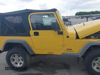 2005 Jeep Wrangler SE z VIN 1J4FA29S95P373313, wystawiony jako IAAI lot #42340611 z przebiegiem 162 801 mil mil oraz . Historia ofert i sprzedaży dostępna na DreamBid. Obrazek 13.