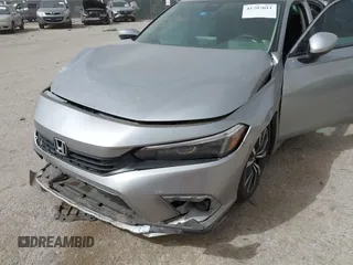 2023 Honda Civic EX with VIN 2HGFE1F77PH321210, listed as a IAAI auction lot 41797011 with 8,748 mi miles and . Bid and sale history available at DreamBid. Image 6.
