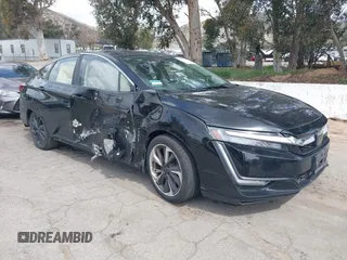 2018 Honda Clarity Plug-In Hybrid with VIN JHMZC5F10JC014054, listed as a IAAI auction lot 41932195 with 100,643 mi miles. Bid and sale history available at carsss.com. Image 1.