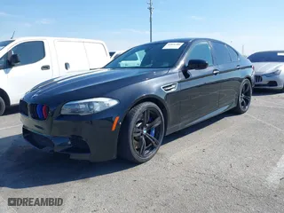2013 BMW M5 with VIN WBSFV9C54DC772568, listed as a IAAI auction lot 41866486 with 99,072 mi miles. Bid and sale history available at carsss.com. Image 2.