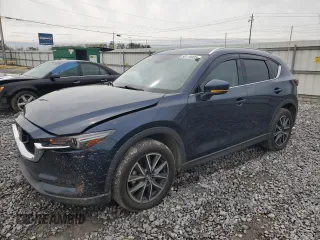 2017 Mazda CX-5 Grand Touring with VIN JM3KFADL3H0125143, listed as a Copart auction lot 50178005 with 160,058 mi miles and Salvage Title. Bid and sale history available at carsss.com. Image 1.