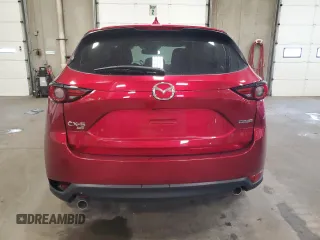 2020 Mazda CX-5 Grand Touring with VIN JM3KFBDM9L0760861, listed as a Copart auction lot 60977275 with 58,608 mi miles and Salvage title. Bid and sale history available at DreamBid. Image 6.