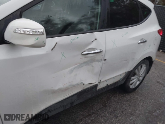 2013 Hyundai Tucson GLS with VIN KM8JU3AC4DU675511, listed as a IAAI auction lot 40765852 with 147,061 mi miles. Bid and sale history available at carsss.com. Image 6.