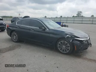2018 BMW 5 Series 540i with VIN WBAJE5C54JWA93338, listed as a Copart auction lot 54312385 with 77,537 mi miles and Salvage title. Bid and sale history available at DreamBid. Image 4.
