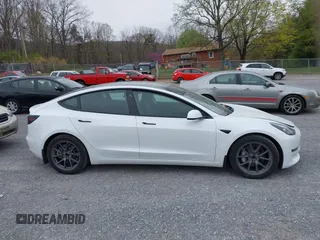 2021 Tesla Model 3 Long Range with VIN 5YJ3E1EBXMF980102, listed as a IAAI auction lot 41944364 with 48,766 mi miles and . Bid and sale history available at carsss.com. Image 13.