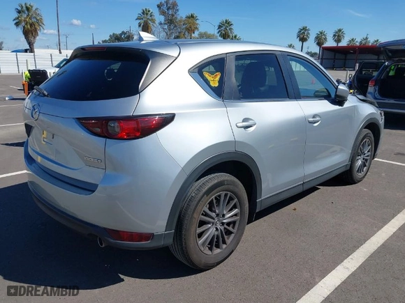 2020 Mazda CX-5 Touring with VIN JM3KFACM7L0774401, listed as a IAAI auction lot 41803453 with NaN miles. Bid and sale history available at carsss.com. Image 4.