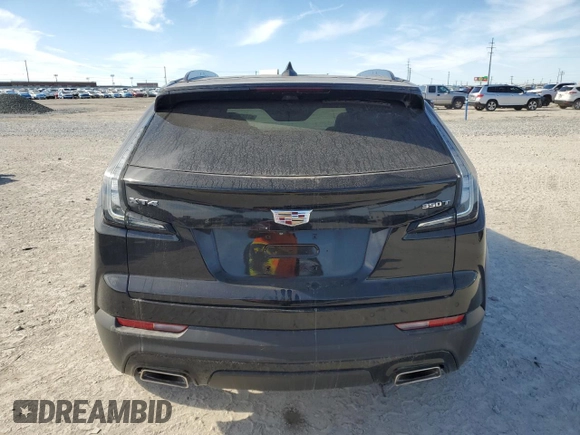 2023 Cadillac XT4 FWD Sport with VIN 1GYFZER47PF107311, listed as a Copart auction lot 87583565 with 26,585 mi miles and Salvage title. Bid and sale history available at DreamBid. Image 6.