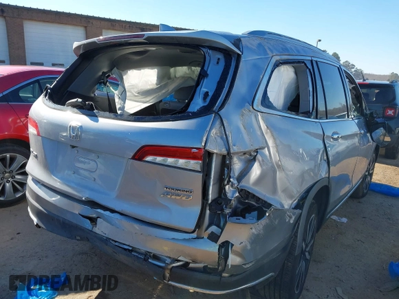 2019 Honda Pilot Touring 7-Passenger with VIN 5FNYF6H60KB038846, listed as a IAAI auction lot 41339385 with Not provided miles and . Bid and sale history available at DreamBid. Image 6.
