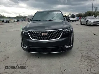 2021 Cadillac XT6 Premium Luxury z VIN 1GYKPCRS1MZ169952, wystawiony jako Copart lot #51908895 z przebiegiem 31 834 mil mil oraz Szkody całkowita. Historia ofert i sprzedaży dostępna na DreamBid. Obrazek 12.