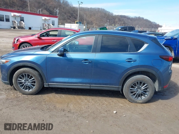 2021 Mazda CX-5 Touring with VIN JM3KFBCM4M0404093, listed as a IAAI auction lot 41751343 with 50,536 mi miles. Bid and sale history available at carsss.com. Image 14.