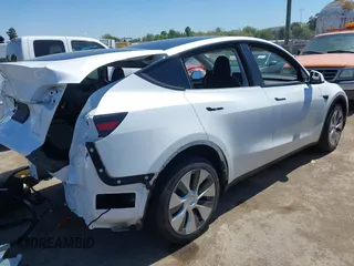 2023 Tesla Model Y Long Range with VIN 7SAYGDEE1PF660444, listed as a IAAI auction lot 42065046 with 23,601 mi miles and . Bid and sale history available at DreamBid. Image 4.