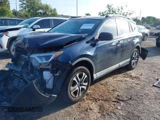 2018 Toyota RAV4 LE with VIN JTMZFREV1JJ203943, listed as a IAAI auction lot 41921863 with 104,691 mi miles. Bid and sale history available at carsss.com. Image 17.