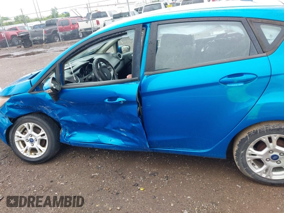 2015 Ford Fiesta SE z VIN 3FADP4EJ9FM133020, wystawiony jako IAAI lot #42302738 z przebiegiem 115 669 mil mil oraz . Historia ofert i sprzedaży dostępna na DreamBid. Obrazek 14.