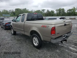 2002 Ford F-150 XL with VIN 1FTRX18L02NA58574, listed as a Copart auction lot 57156255 with 291,950 mi miles and Salvage title. Bid and sale history available at DreamBid. Image 2.