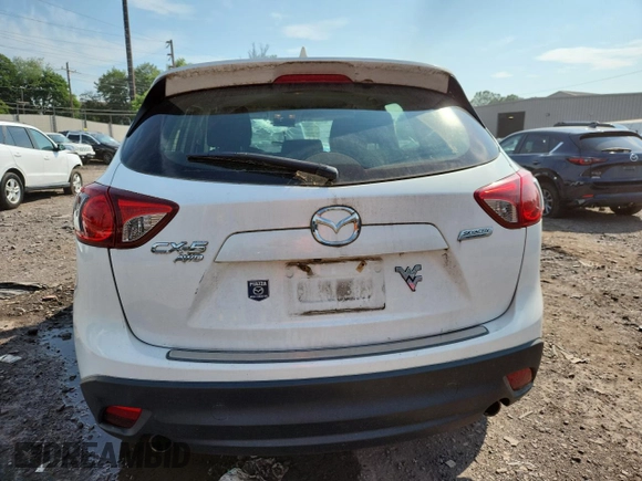 2016 Mazda CX-5 Sport with VIN JM3KE4BYXG0704194, listed as a Copart auction lot 62095735 with 93,970 mi miles and Salvage title. Bid and sale history available at DreamBid. Image 6.
