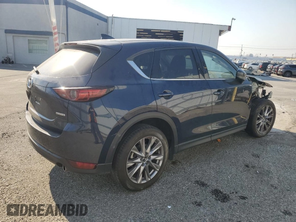 2021 Mazda CX-5 Grand Touring with VIN JM3KFADM7M0385788, listed as a Copart auction lot 88065255 with 27,787 mi miles and Salvage Title. Bid and sale history available at carsss.com. Image 3.