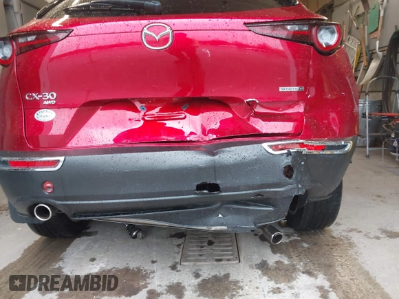 2023 Mazda CX-30 S Premium with VIN 3MVDMBDM5PM518612, listed as a IAAI auction lot 42219265 with 29,135 mi miles and . Bid and sale history available at DreamBid. Image 6.