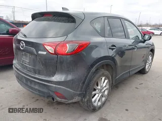 2015 Mazda CX-5 Grand Touring with VIN JM3KE4DY0F0479229, listed as a IAAI auction lot 41838381 with 139,843 mi miles. Bid and sale history available at carsss.com. Image 4.