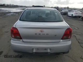 2002 Toyota ECHO with VIN JTDBT123420202436, listed as a Copart auction lot 48917245 with 114,865 mi miles and Salvage title. Bid and sale history available at DreamBid. Image 6.