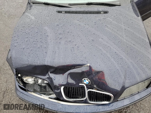 2000 BMW 3 Series 323i with VIN WBAAM3340YFP70049, listed as a Copart auction lot 58064415 with 122,574 mi miles and Clean title. Bid and sale history available at DreamBid. Image 11.