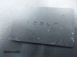 2018 Tesla Model 3 Long Range Battery with VIN 5YJ3E1EAXJF027179, listed as a IAAI auction lot 42059918 with 43,566 mi miles. Bid and sale history available at carsss.com. Image 11.