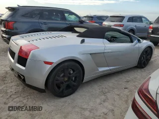 2007 Lamborghini Gallardo z VIN ZHWGU22T57LA05137, wystawiony jako Copart lot #76275354 z przebiegiem Nie podano mil oraz Szkody całkowita. Historia ofert i sprzedaży dostępna na DreamBid. Obrazek 3.