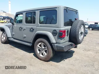 2022 Jeep Wrangler Unlimited Sahara with VIN 1C4HJXEM7NW206585, listed as a IAAI auction lot 42102516 with 10,769 mi miles and . Bid and sale history available at DreamBid. Image 3.