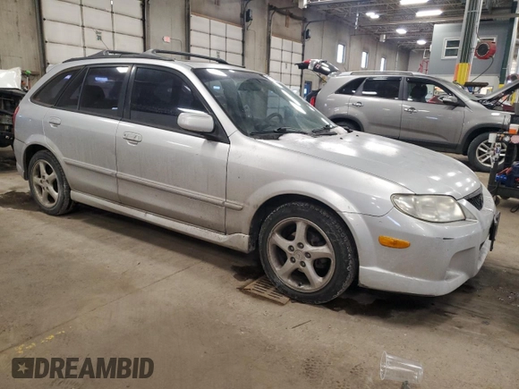 2002 Mazda Protege z VIN JM1BJ245X21565456, wystawiony jako Copart lot #43756385 z przebiegiem 195 892 mil mil oraz Szkoda całkowita • Salvage title. Historia ofert i sprzedaży dostępna na DreamBid. Obrazek 4.