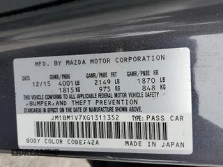 2016 Mazda 3 i Touring z VIN JM1BM1V7XG1311352, wystawiony jako Copart lot #56194805 z przebiegiem 115 321 mil mil oraz Szkoda całkowita • Salvage title. Historia ofert i sprzedaży dostępna na DreamBid. Obrazek 12.