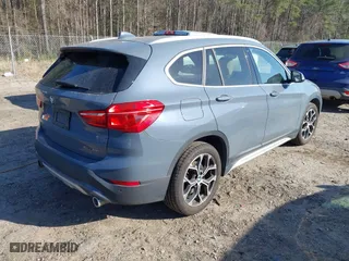 2021 BMW X1 xDrive28i with VIN WBXJG9C07M5T23053, listed as a IAAI auction lot 41774663 with 66,770 mi miles. Bid and sale history available at carsss.com. Image 4.