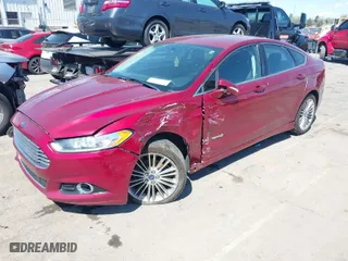 2014 Ford Fusion SE Hybrid with VIN 3FA6P0LU8ER253939, listed as a IAAI auction lot 41882200 with 241,178 mi miles. Bid and sale history available at carsss.com. Image 2.