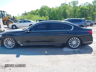 2016 BMW 7 Series 740i with VIN WBA7E2C55GG547752, listed as a IAAI auction lot 41992704 with Not Provided miles and . Bid and sale history available at carsss.com. Image 13.