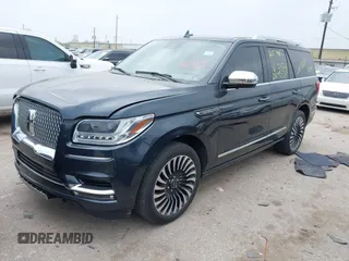 2021 Lincoln Navigator Black Label z VIN 5LMJJ2TT6MEL13834, wystawiony jako IAAI lot #41801640 z przebiegiem 59 843 mil mil oraz . Historia ofert i sprzedaży dostępna na DreamBid. Obrazek 2.