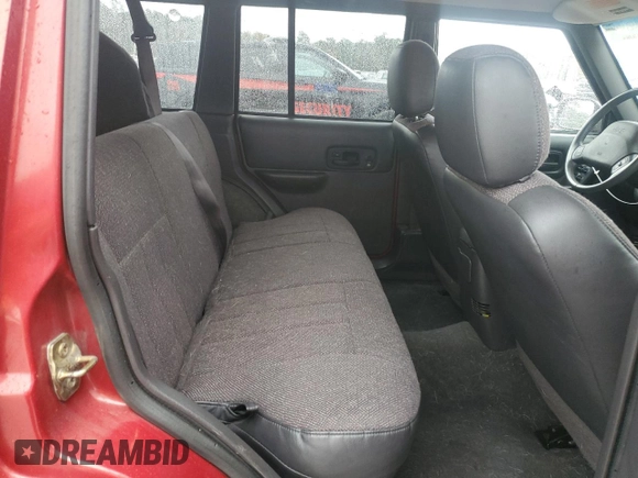 1999 Jeep Cherokee Sport with VIN 1J4FT68S1XL601799, listed as a Copart auction lot 83881844 with 203,572 mi miles and Salvage title. Bid and sale history available at DreamBid. Image 11.
