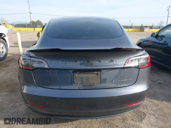 2019 Tesla Model 3 Long Range with VIN 5YJ3E1EB6KF413320, listed as a IAAI auction lot 41760428 with 90,441 mi miles and . Bid and sale history available at DreamBid. Image 15.
