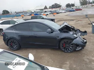 2024 Tesla Model Y Performance with VIN 7SAYGDEF7RF053265, listed as a IAAI auction lot 42132172 with 17,102 mi miles and . Bid and sale history available at DreamBid. Image 13.